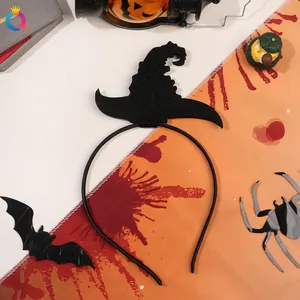 Detail of black glittery witch hat headband for Halloween costumes on festive background