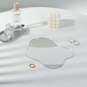 Irregular silver acrylic mirror tray for jewelry display with minimalist props
