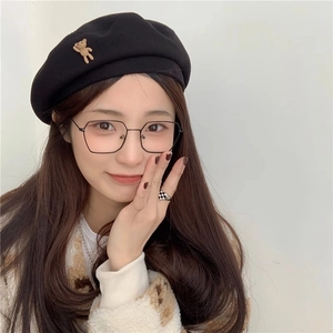 Classic black wool beret for women featuring a cute 3D brown bear decoration