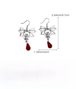 Detailed view of Gothic bat earrings with red drop pendant and size measurements