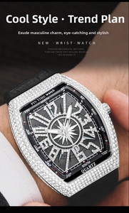 Close-up of luxury tonneau watch with iced-out diamond bezel and black rubber strap