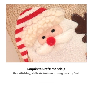 Close-up of burlap Christmas stocking featuring detailed felt Santa Claus embroidery
