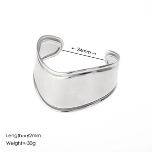 Minimalist wide wave cuff bracelet in polished silver stainless steel with open design
