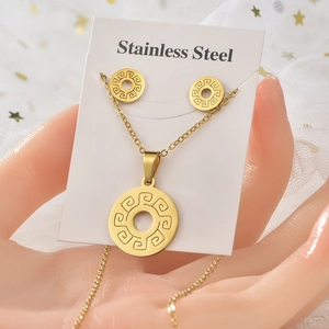 Golden stainless steel jewelry set featuring geometric circular necklace and stud earrings