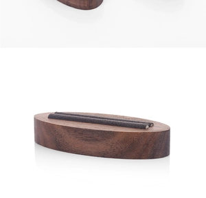 Minimalist walnut wood ring display stand with grey velvet slots for jewelry display