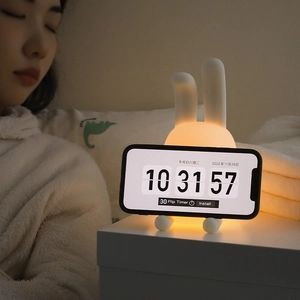 Cartoon rabbit night light with soft silicone texture and phone holder stand function