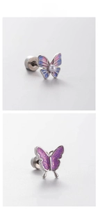 Macro detail of butterfly earrings with enamel gradient and pearl on titanium steel