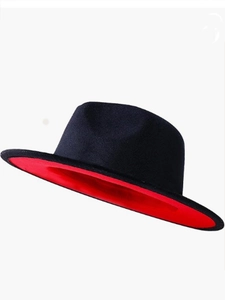 Detail view of stylish flat brim felt jazz hat with black crown and vibrant red underbrim