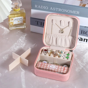 Portable pink PU leather jewelry box for rings and necklaces with compact storage slots