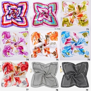 Detail view of nine various fashion silk scarves featuring diverse geometric and floral patterns