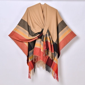 Detail of khaki plaid shawl featuring soft fringe edges and a front knot design