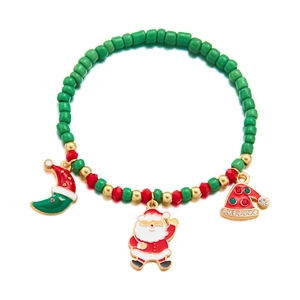 Detail of Christmas beaded bracelet featuring Santa Claus, hat and moon charms with rhinestones