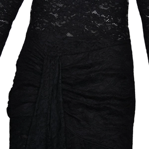 Macro shot of sheer black lace fabric texture on tight jumpsuit waist and hip detail