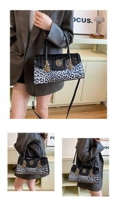 Detail of leopard print and crocodile texture crossbody bag with gold lion head hardware