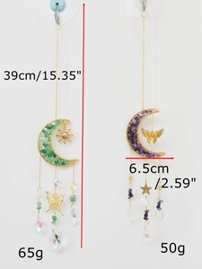 Detail of crystal suncatchers with moon frames, amethyst stones, and hanging prisms