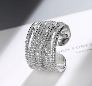 Macro shot of S925 sterling silver multi-layer wave ring with cubic zirconia paving