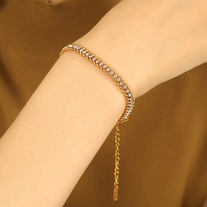 Three-layer 18K gold plated stainless steel bracelet with white zircon worn on a wrist
