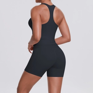 Detail view of the racerback design and tight fit of the black athletic yoga set