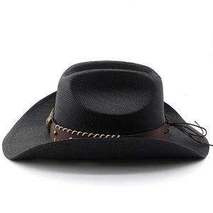 Close-up of black denim straw hat with leather band and vintage bronze bull head