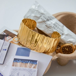 Minimalist wide textured 18K gold stainless steel open bangle with pleated metal finish