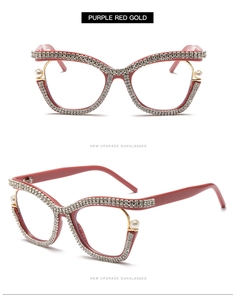 Detail of purple-red cat eye frames with luxury rhinestone and pearl accents