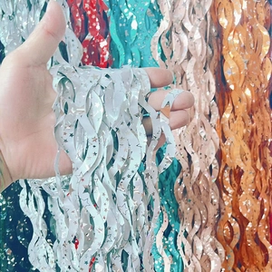 Silver S-shaped party foil fringe curtain backdrop with metallic star pattern decor