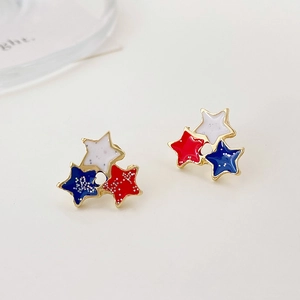 Detail of red white and blue triple star stud earrings with sparkly glitter finish
