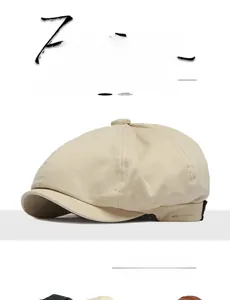 Detail of beige cotton newsboy cap showing textured twill fabric and vintage style