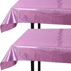 Macro detail of two pink metallic laser party tablecloths with glossy texture
