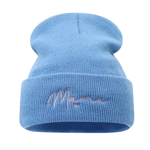 Light blue knit beanie featuring pink Mama embroidery with a small heart on the cuff