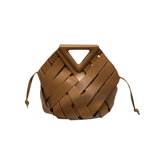 Brown woven leather bucket bag with unique triangle top handle and drawstring details