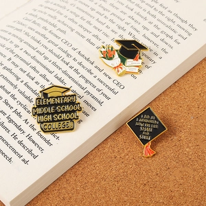 Three-piece graduation enamel pin set with mortarboard, books, and roses on a zinc alloy finish