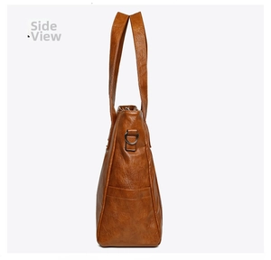 Side view of brown lychee-textured tote bag with side pocket and metal D-ring detail