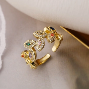 18K gold plated copper leaf open ring with colorful zircon stones in a macro top view
