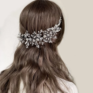 Close-up of bridal crystal hair comb accessory with silver wire vines and beads