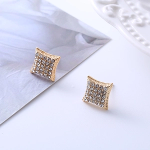 Macro shot of gold-plated square stud earrings featuring micro-pave cubic zirconia settings