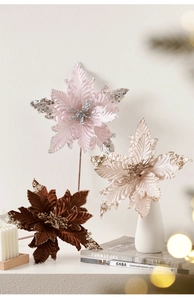 Velvet artificial poinsettia with glitter petals in warm tones for festive home decor