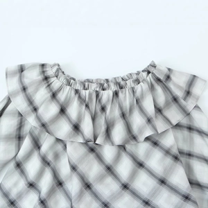 Women's plaid off-shoulder blouse featuring ruffle collar and elastic pleated neckline