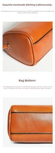 Close-up view showing fine stitching and reinforced bottom details of the leather barrel bag.