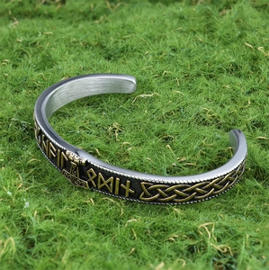 Viking Thor Hammer open bangle in silver and gold stainless steel on green background