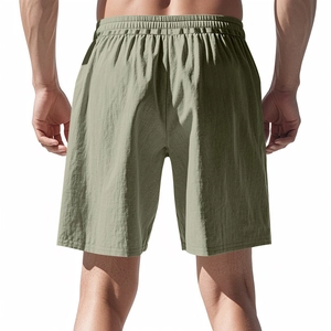Detailed back view of olive green breathable linen-blend beach shorts on model
