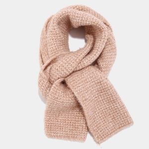Close-up of thick camel knit scarf with soft texture and delicate fringe edges