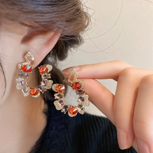 Vintage C-shaped drop earrings with orange and purple zircon stones in gold plating