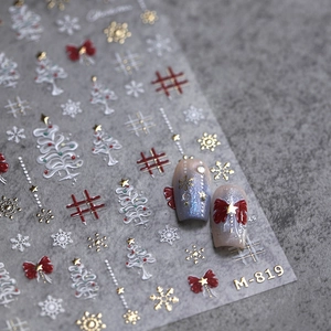 Christmas nail stickers M-819 with red bows, snowflakes and plaid patterns on gray background