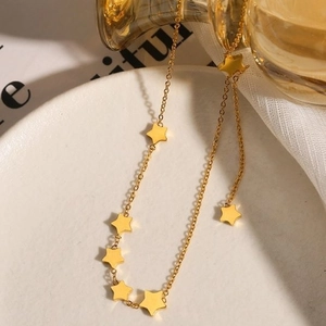 Elegant gold titanium steel necklace featuring multiple minimalist star-shaped pendants
