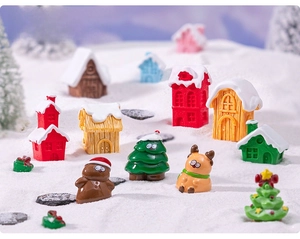 Macro shot of miniature Christmas house figurines and reindeer for DIY holiday snow scenes