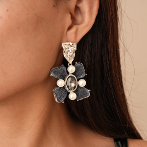 Vintage floral drop earrings with pearls and crystals on a model for a chic retro look