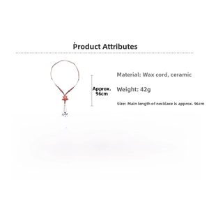 Detail of ethnic style ceramic star pendant with tassel and beads on wax cord necklace