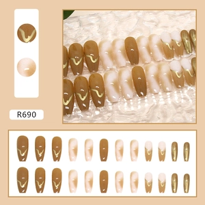 Detailed set of 24 caramel amber press-on nails with golden waves and gradient designs
