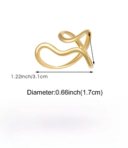 Macro detail of gold wave ring dimensions 1.7cm diameter in polished stainless steel